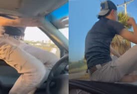 سائق يجلس على غطاء محرك سيارته أثناء سيرها بالأردن.. والشرطة تقبض عليه